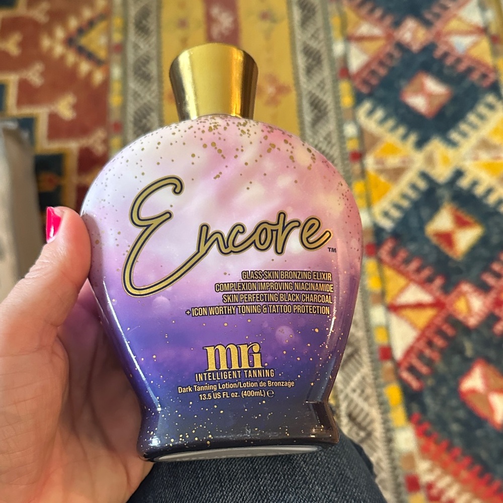 Encore Dark Tanning Lotion with Purple and Gold Design